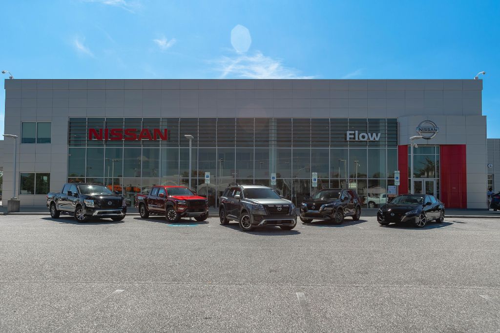 nissan-dealer-near-fayetteville-lumberton-nc.jpg Nissan dealership in Fayetteville, NC with numerous Nissan cars, trucks and SUVs for sale all lined up in front