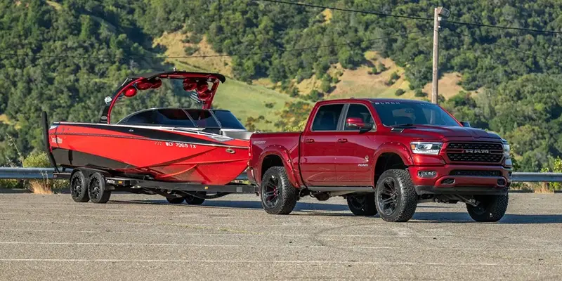 Lifted RAM 1500 towing a boat