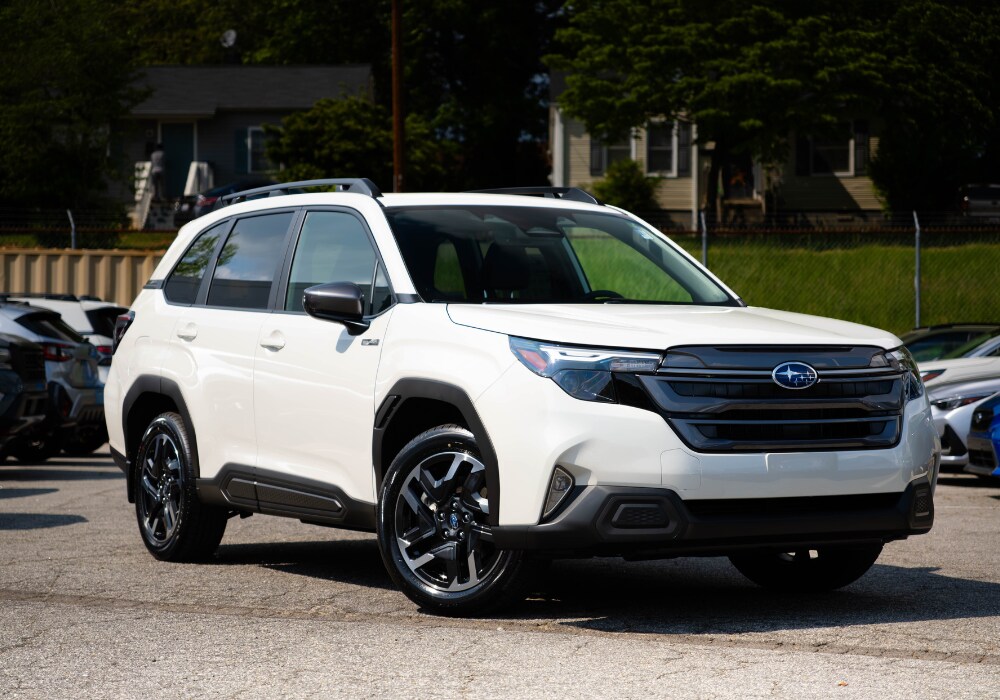2025-subaru-forester-for-sale.png White 2025 Subaru Forester parked in a dealership lot