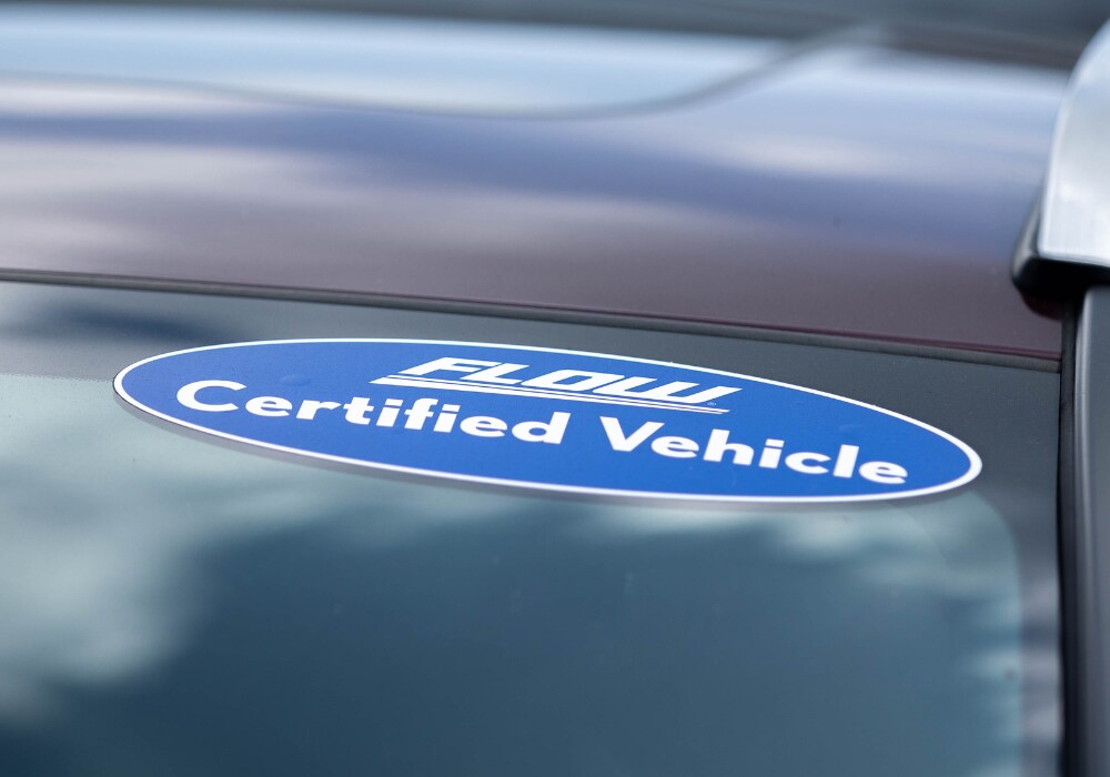 certified-pre-owned-subaru.png Sticker on the front windshield of a car that reads Flow Certified Vehicle