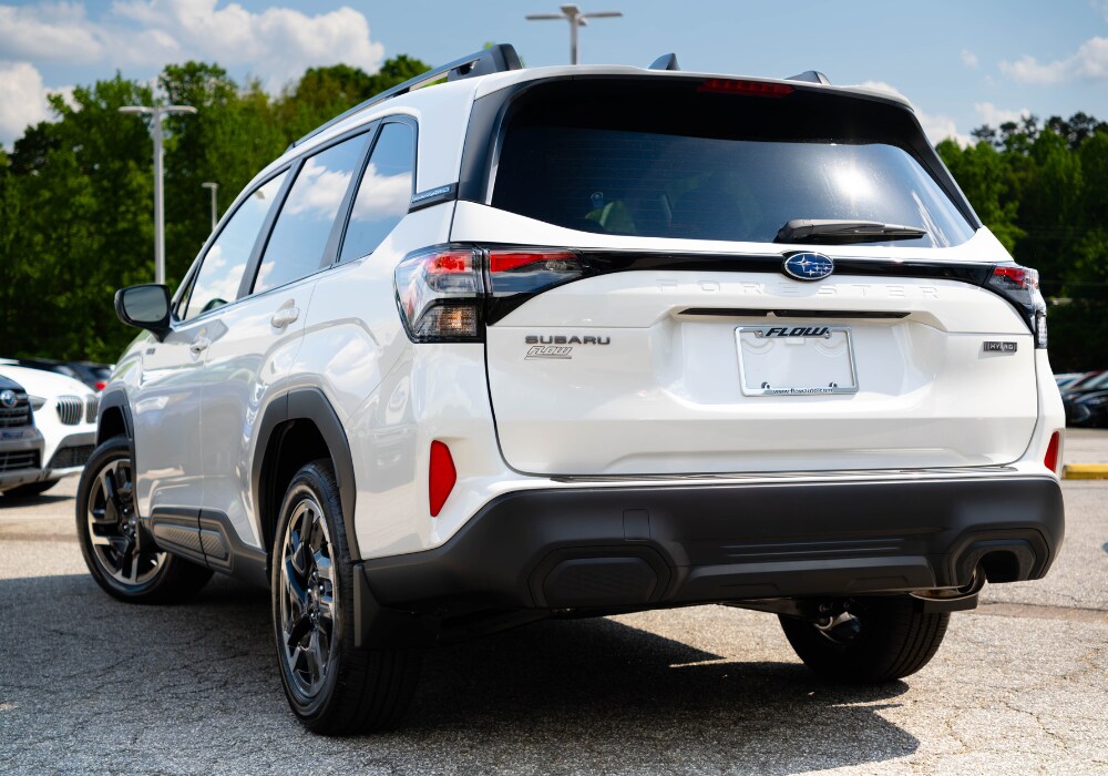 2025-subaru-forester-for-sale-near-winston-salem.png Back of a 2025 Subaru Forester parked in a lot. The SUV is white.