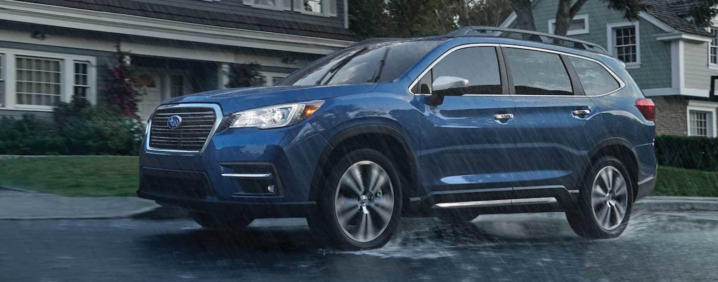 Subaru Ascent dealership - 2022 Subaru Ascent Touring (1).jpg A blue 2022 Subaru Ascent Touring is shown driving in the rain after leaving a Subaru Ascent dealership.