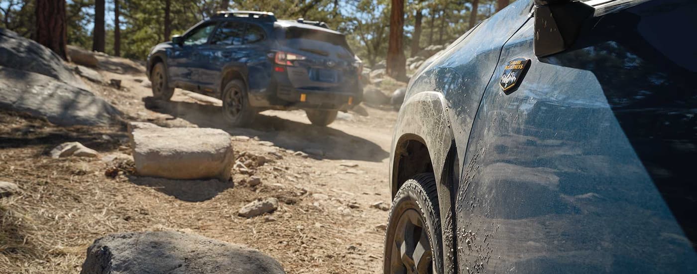 2022 Subaru Forester Wilderness - Follow.jpg A blue 2022 Subaru Forester Wilderness is shown following a Outback on a dirt path.