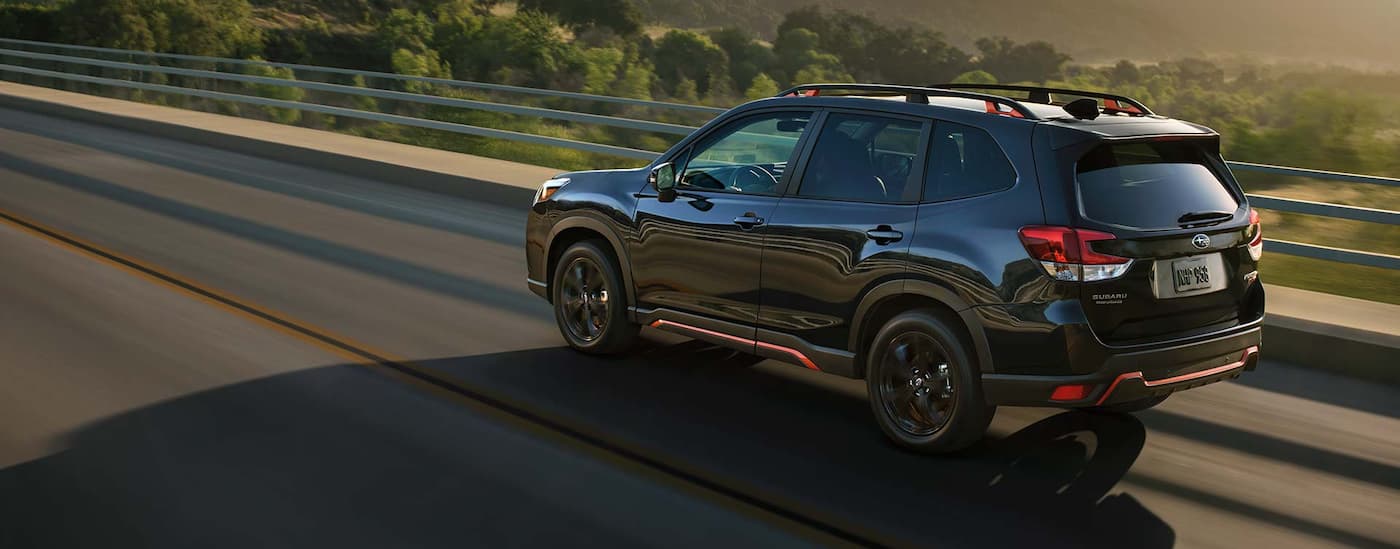 2022 Subaru Forester - Drive.jpg A black 2022 Subaru Forester is shown driving over a bridge.