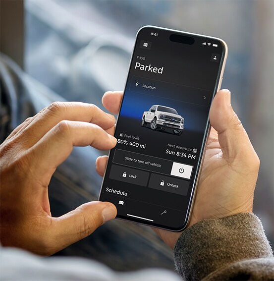 Ford owner using the Ford app to manage vehicle features and Ford Rewards