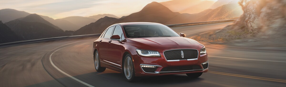2019-Lincoln-MKZ-Reserve-Sedan-Red_34FrntPass-Mountain-Road-Sunset.png