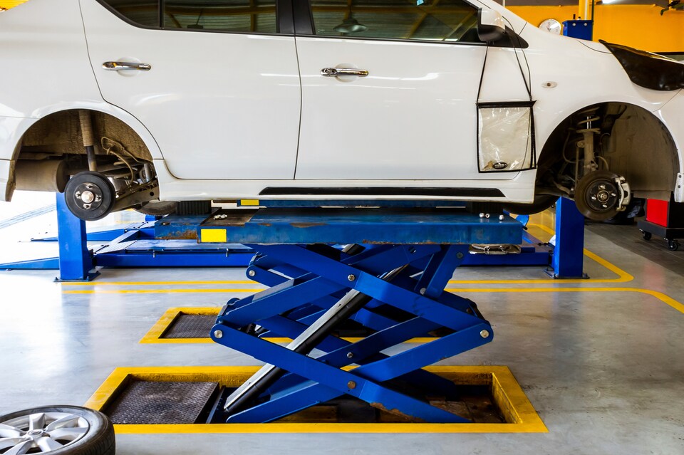 Car on a Lift Having Brakes Replaced