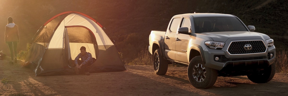 2019 Toyota Tacoma A man and woman going camping with their 2019 Toyota Tacoma