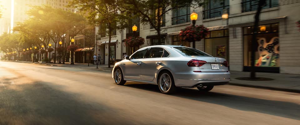 2019 Volkswagen Passat A 2019 Volkswagen Passat driving through a city street at sunset