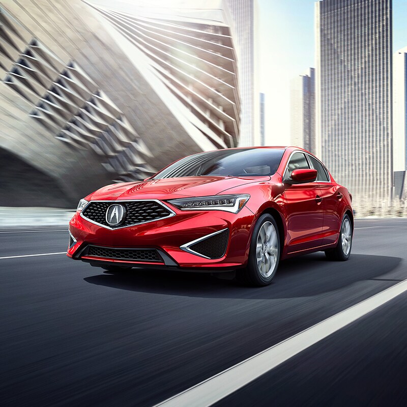 Buy from your Couch at Acura Hunt Valley | Red 2020 Acura ILX Driving Through City