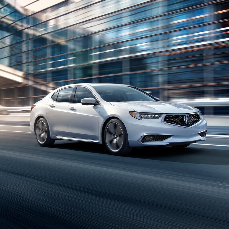 Buy from your Couch at Acura Hunt Valley | White 2020 Acura TLX Driving Through City
