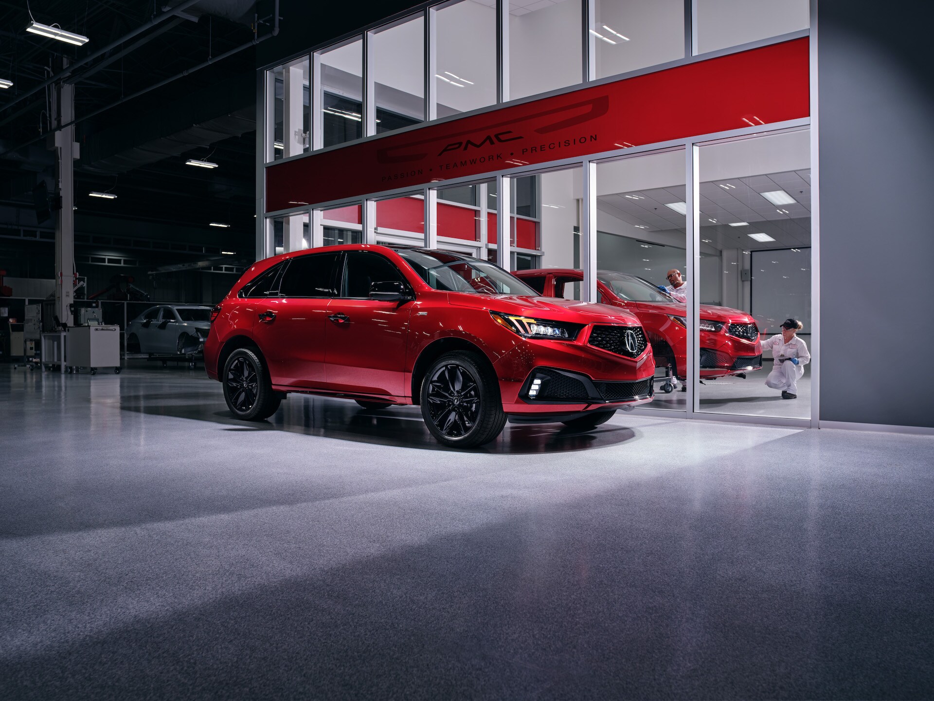 Comparison of the 2020 Acura MDX & 2020 Toyota Highlander at Acura Hunt Valley | Red 2020 Acrua MDX parked in garage