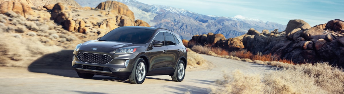 2020-Ford-Escape-Titanium-SUV-L02 (1).jpg New Ford Escape driving through rocky hills