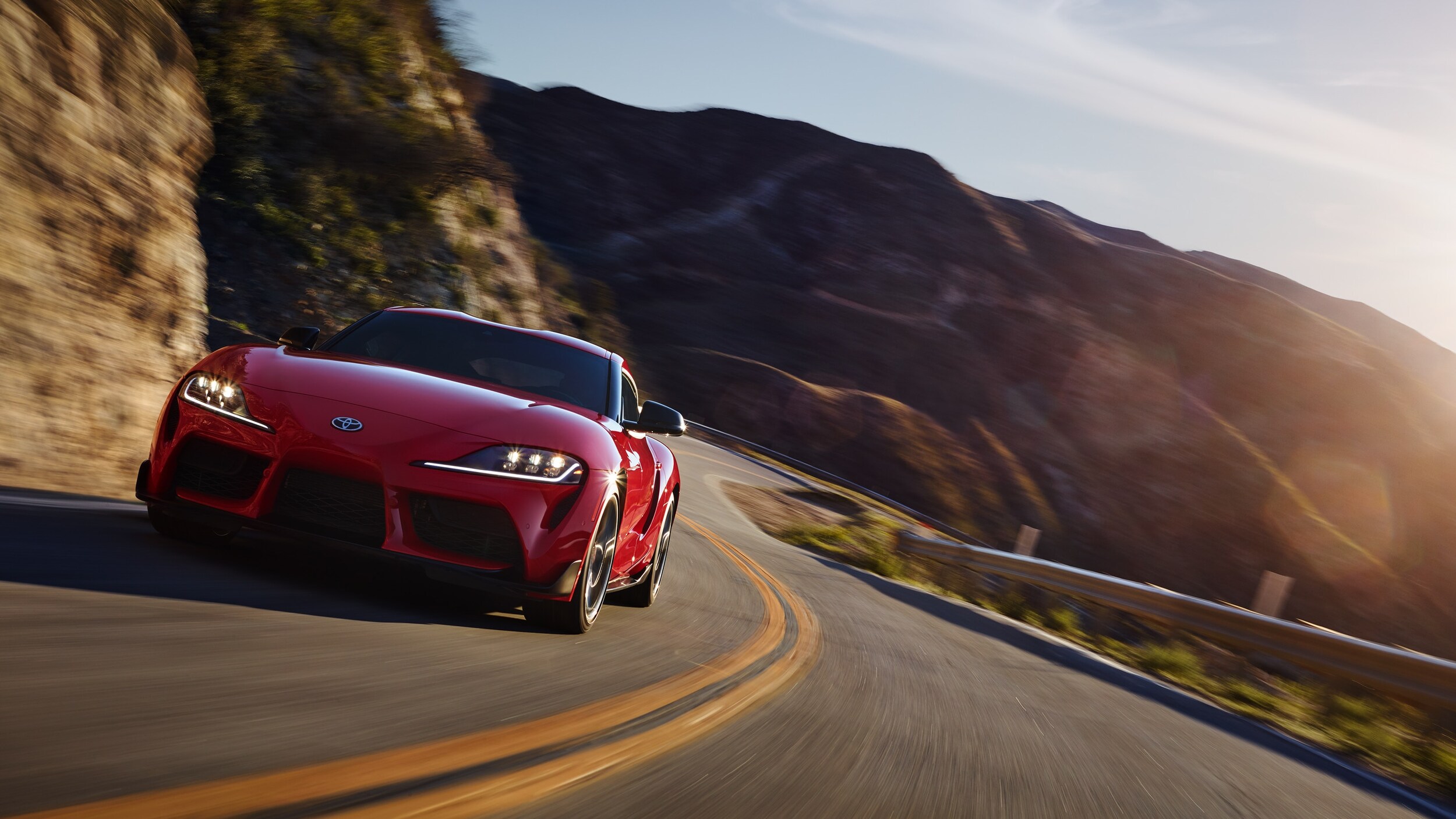 Red Supra on Winding Road
