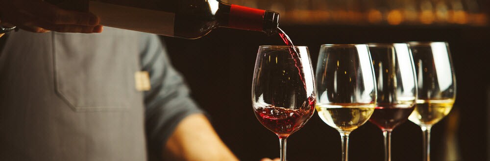 Pouring Wine into Glasses