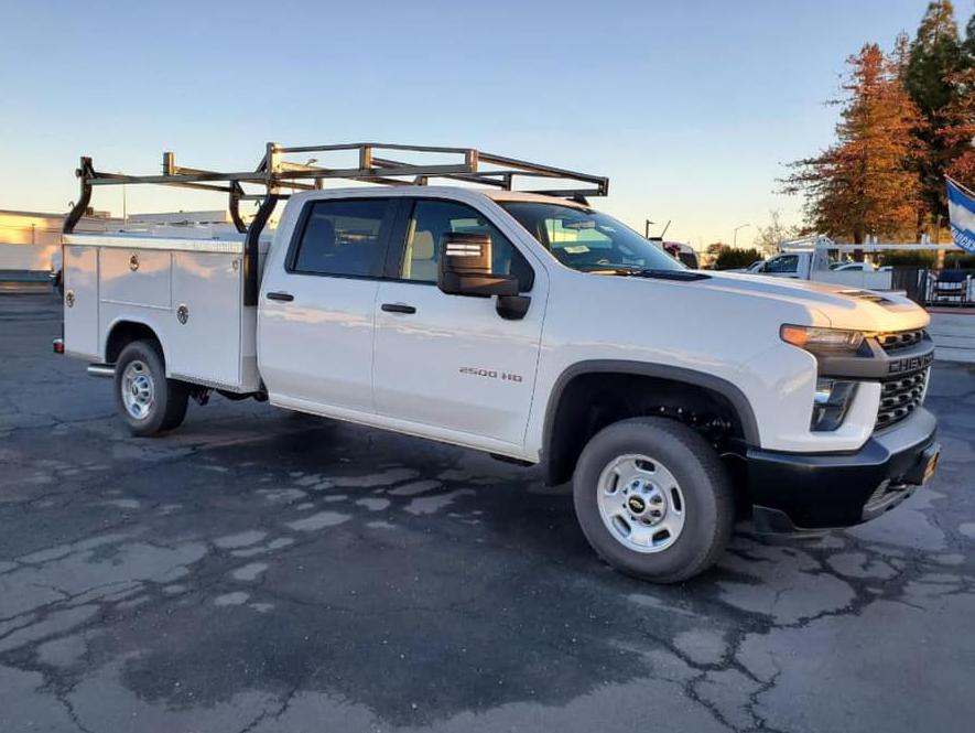 Angle view of a white Chevy Silverado 2500HD crew cab with Royal service body