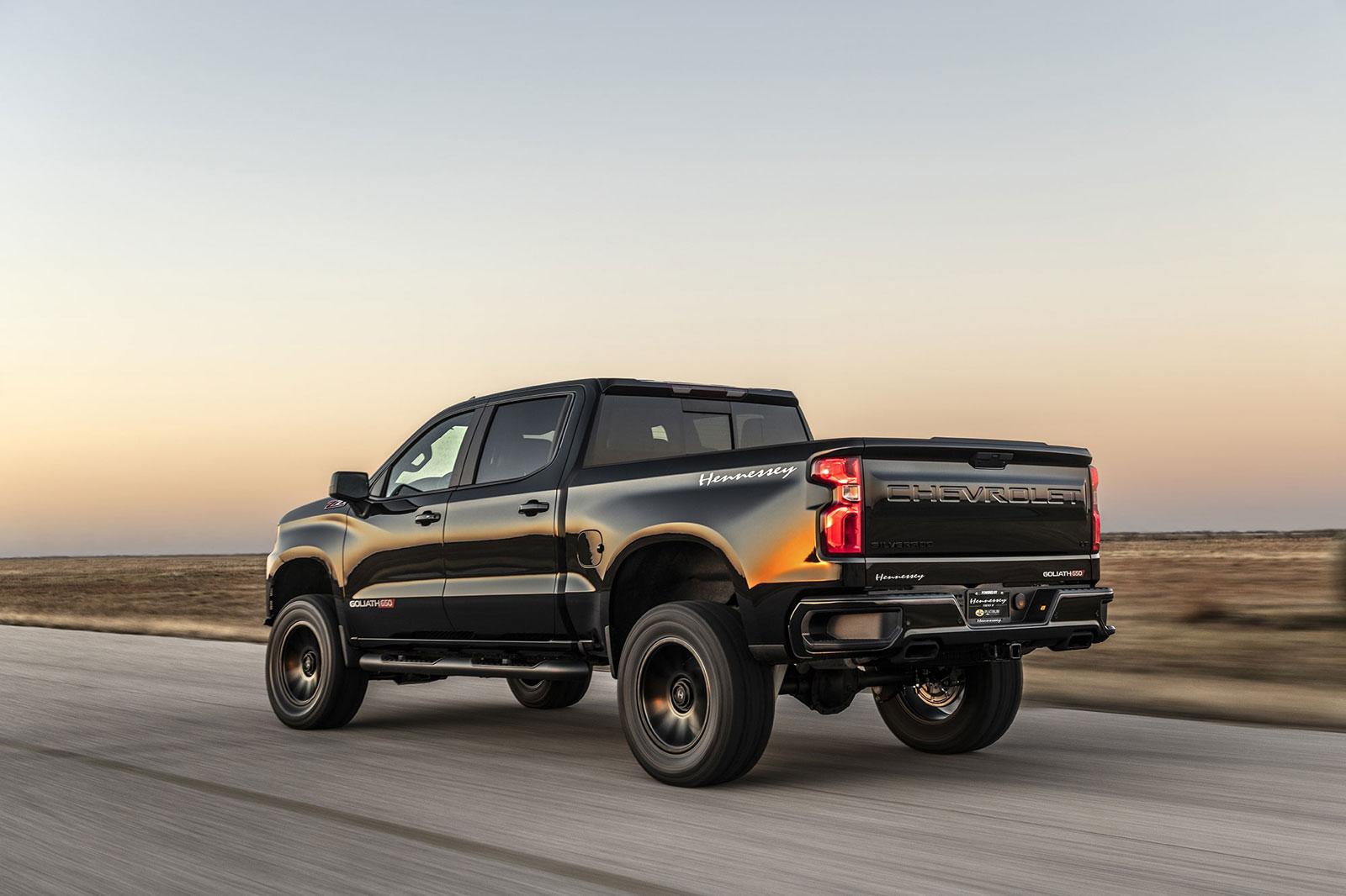 08bcaf1fdf6e466c8d4d12d63c98f958_1600x1066.jpg Shiny black Chevy Silverado with Hennessey Goliath  650 Supercharged upgrades, from rear driver's side