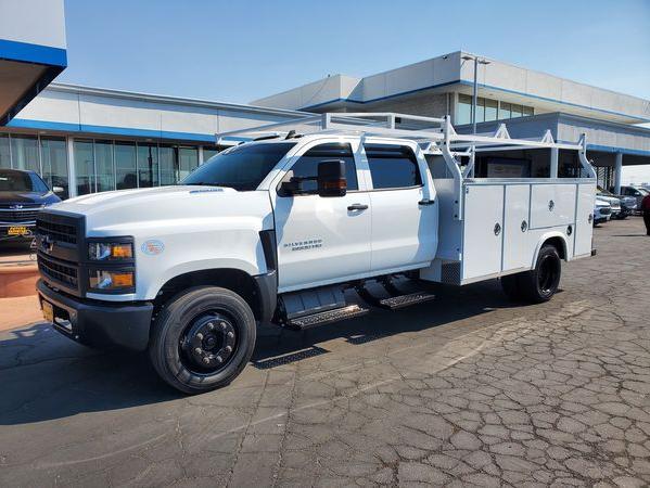 White Chevy Silverado 5500HD with Royal Severe Duty Utility Body, seen from front right