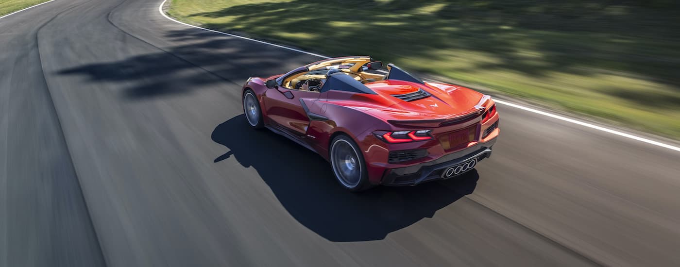 Sacramento Chevy Dealer - 2023 Chevy Corvette Z06 - Drive.jpg A maroon 2023 Chevy Corvette Z06 driving on a race track.