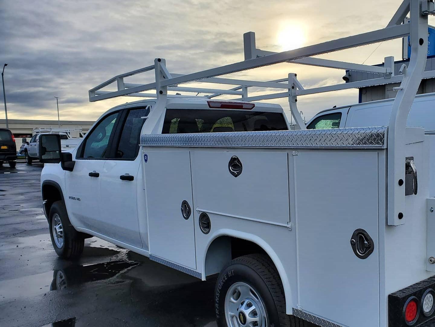 Rear view of a white Chevy Silverado 2500HD double cab with Royal service body