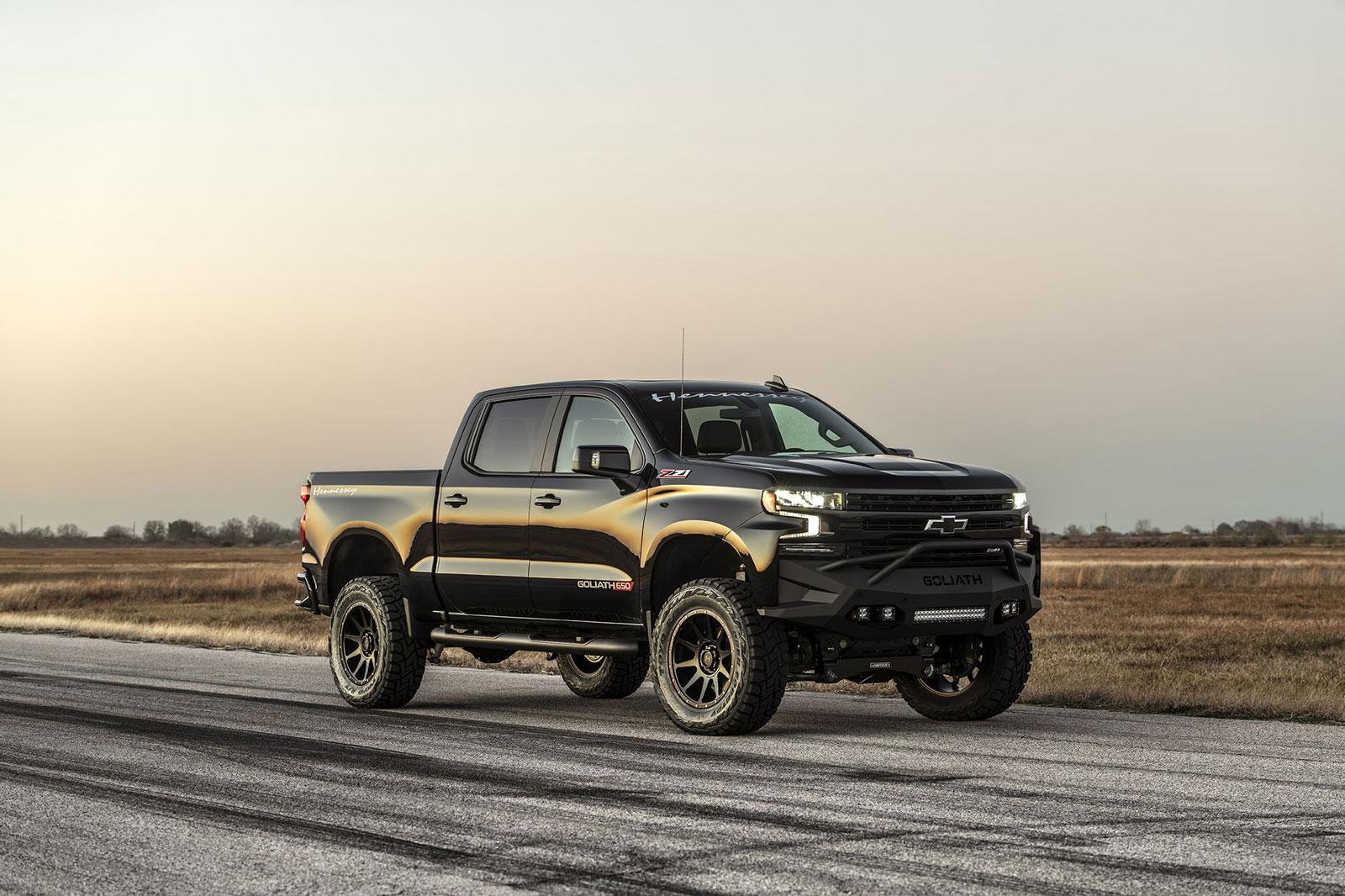 136863d0bc964bd6b998665746014c9f_1600x1066.jpg Shiny black Chevy Silverado with Hennessey Goliath  650 Supercharged upgrades, from passenger side