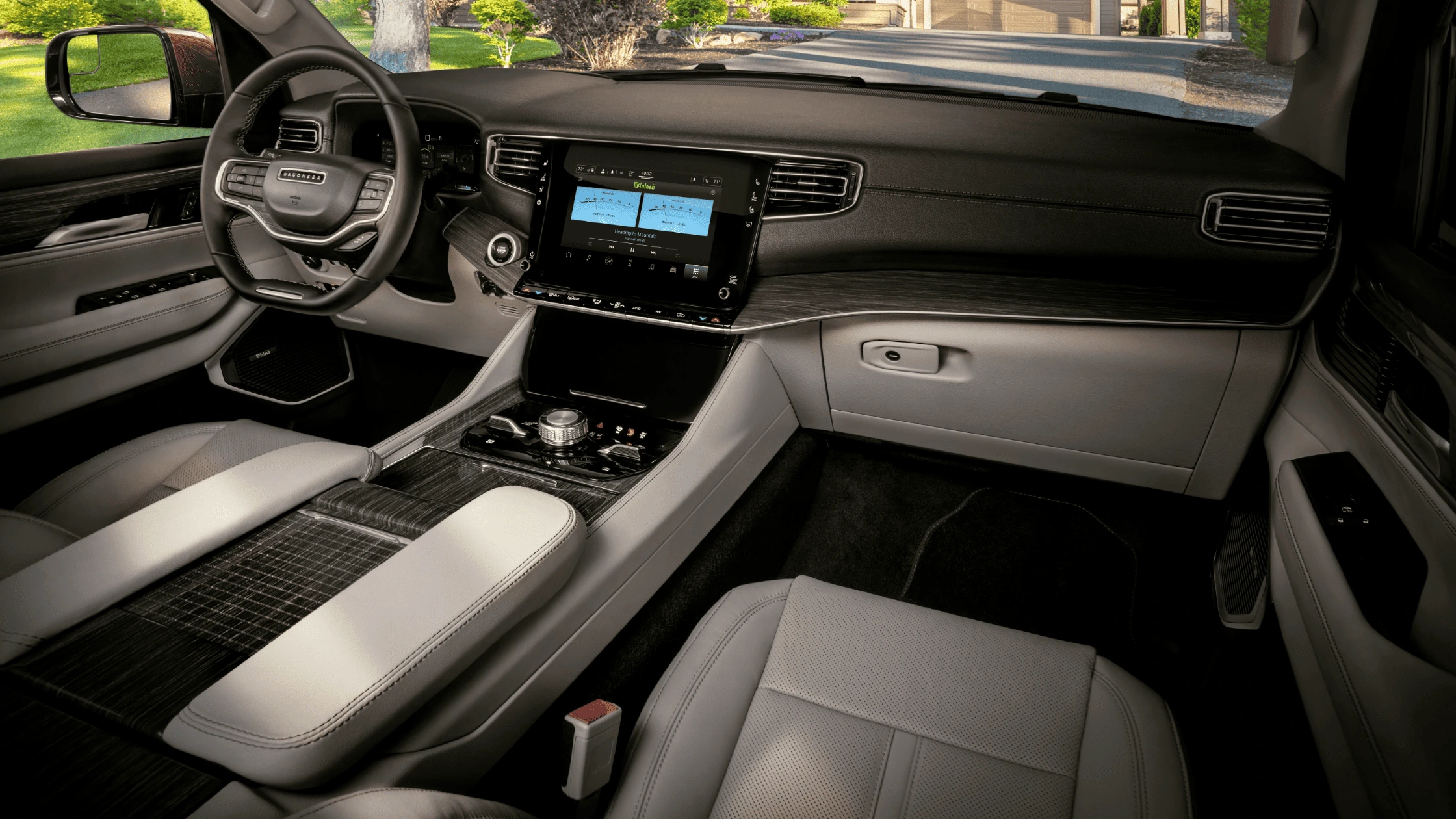 2024 JeepĀ® Wagoneer - Advanced Technology for a Connected Drive Interior dashboard of the 2024 JeepĀ® Wagoneer featuring advanced technology and touchscreen controls, offering a connected and intuitive driving experience.
