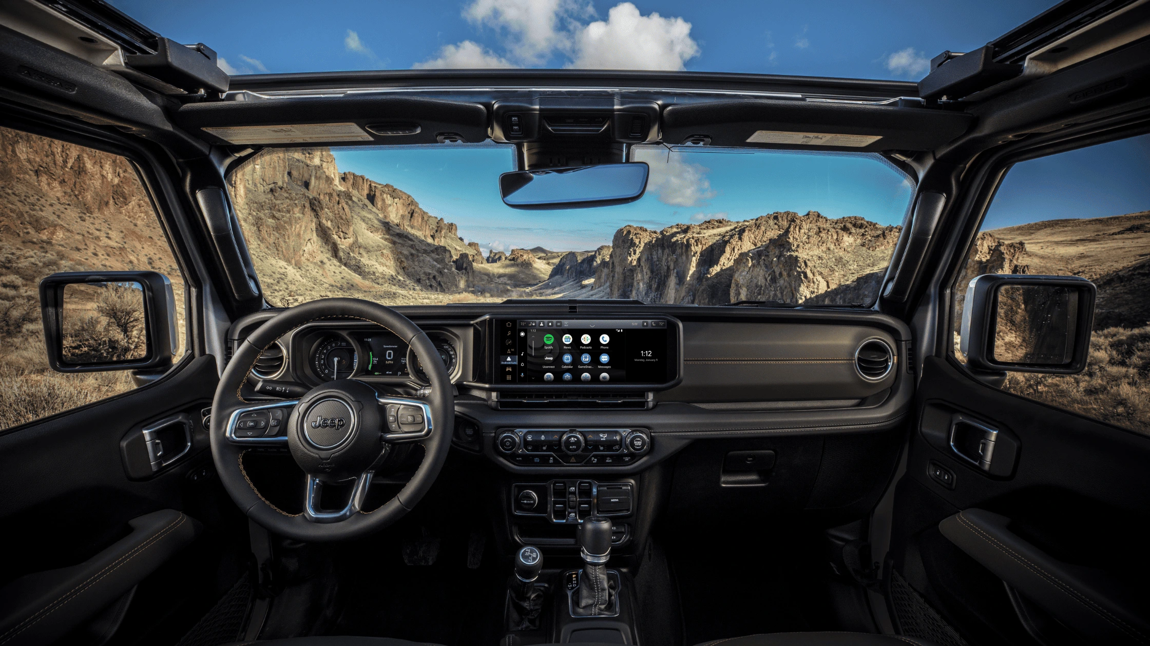 2025 Jeep® Wrangler 4xe - Safety Features and Driver Assistance Systems 2025 Jeep Wrangler 4xe close-up of infotainment with navigation and safety controls
