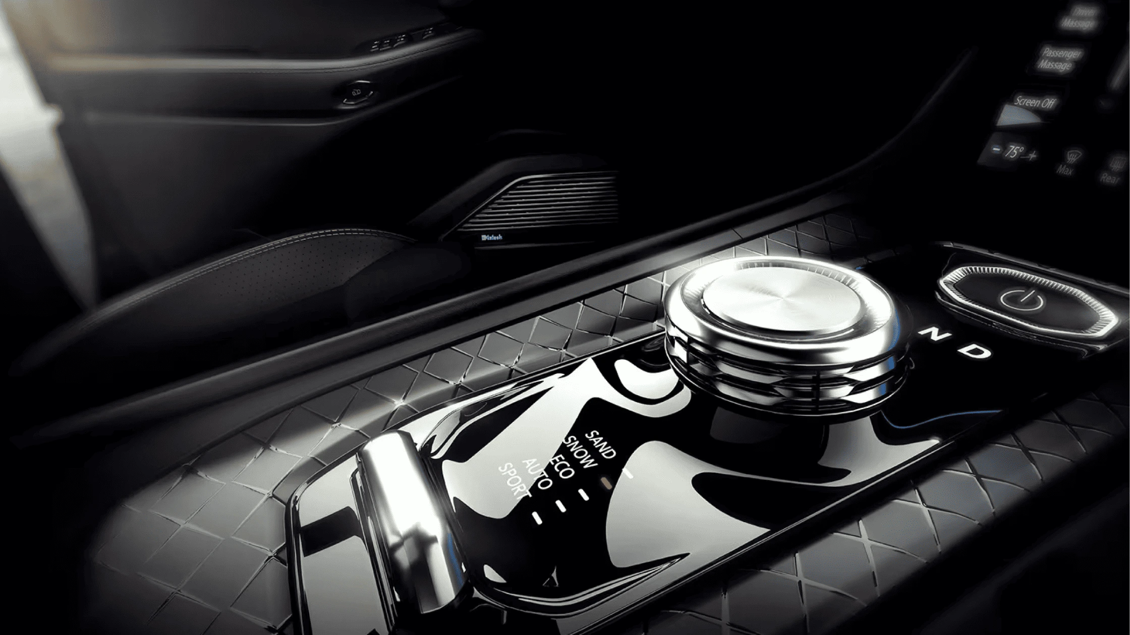 All-Electric Jeep® Wagoneer S - Safety and Driver Assistance Close-up view of a premium gear selector knob in a luxury vehicle, featuring multiple drive modes including Sand, Snow, Eco, Auto, and Sport, surrounded by an elegant quilted-pattern console.
