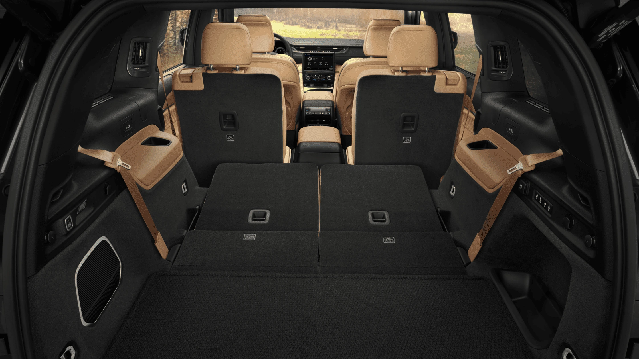 2025 Jeep® Grand Cherokee L - Cabin Design Centered Around Functionality and Comfort 2025 Jeep Grand Cherokee L cargo space with seats folded and tan interior finish