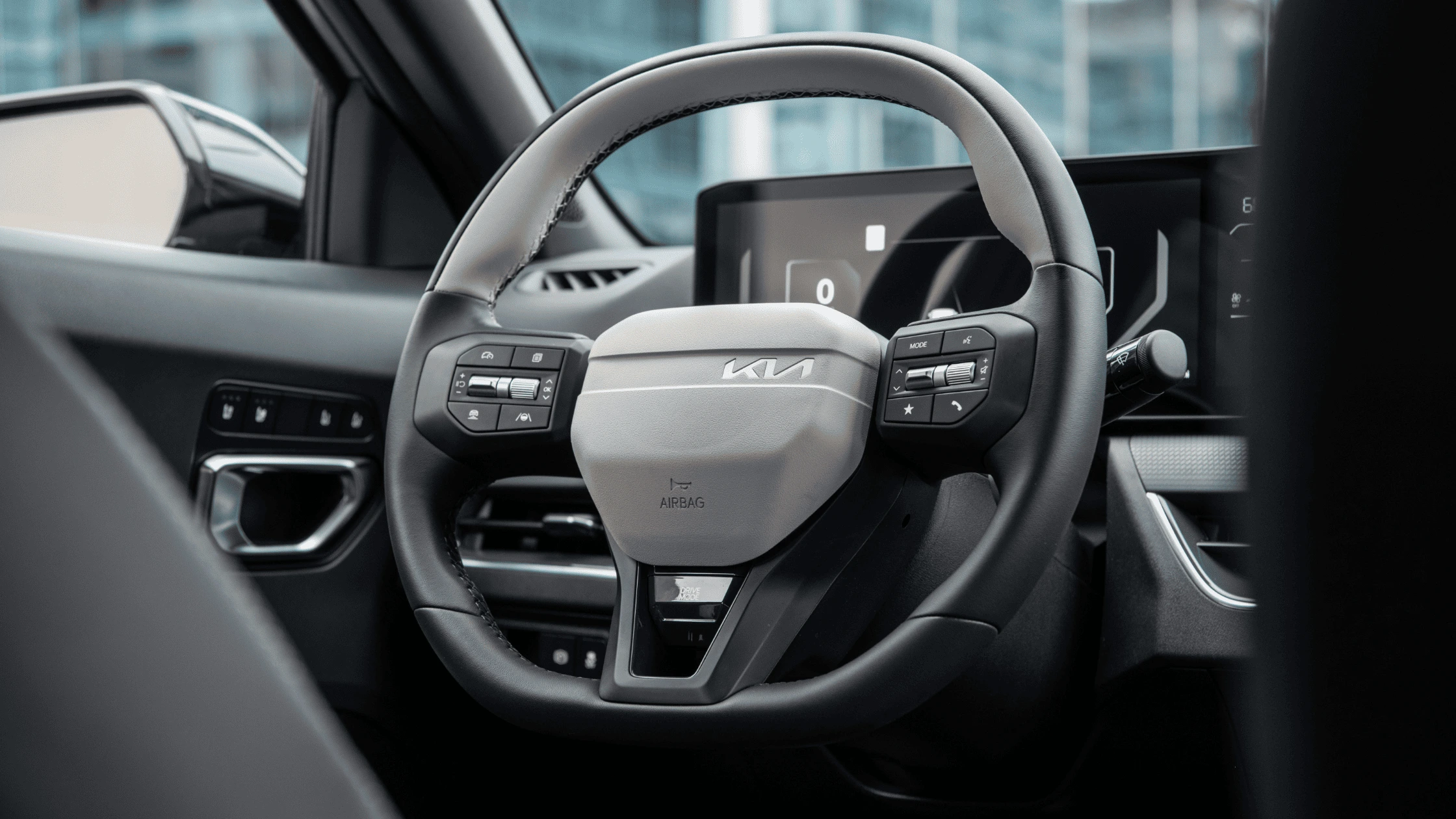2025 Kia K4 - A Driver-Centric Interior Layout 2025 Kia K4 steering wheel with integrated controls