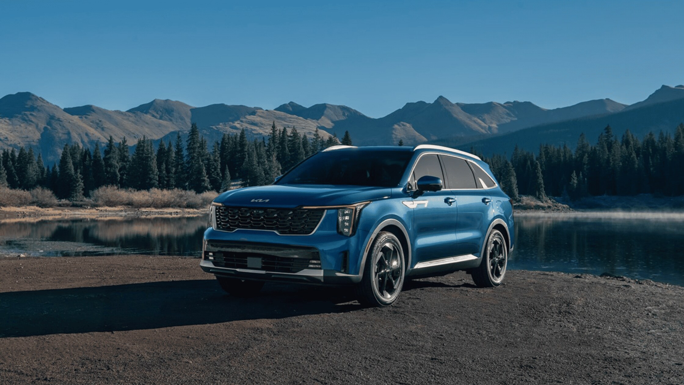 The 2024 Kia Sorento Hybrid near Port Charlotte, FL The 2024 Kia Sorento Hybrid parked in a scenic mountain landscape, showcasing its stylish design and eco-friendly hybrid technology near Port Charlotte, FL.