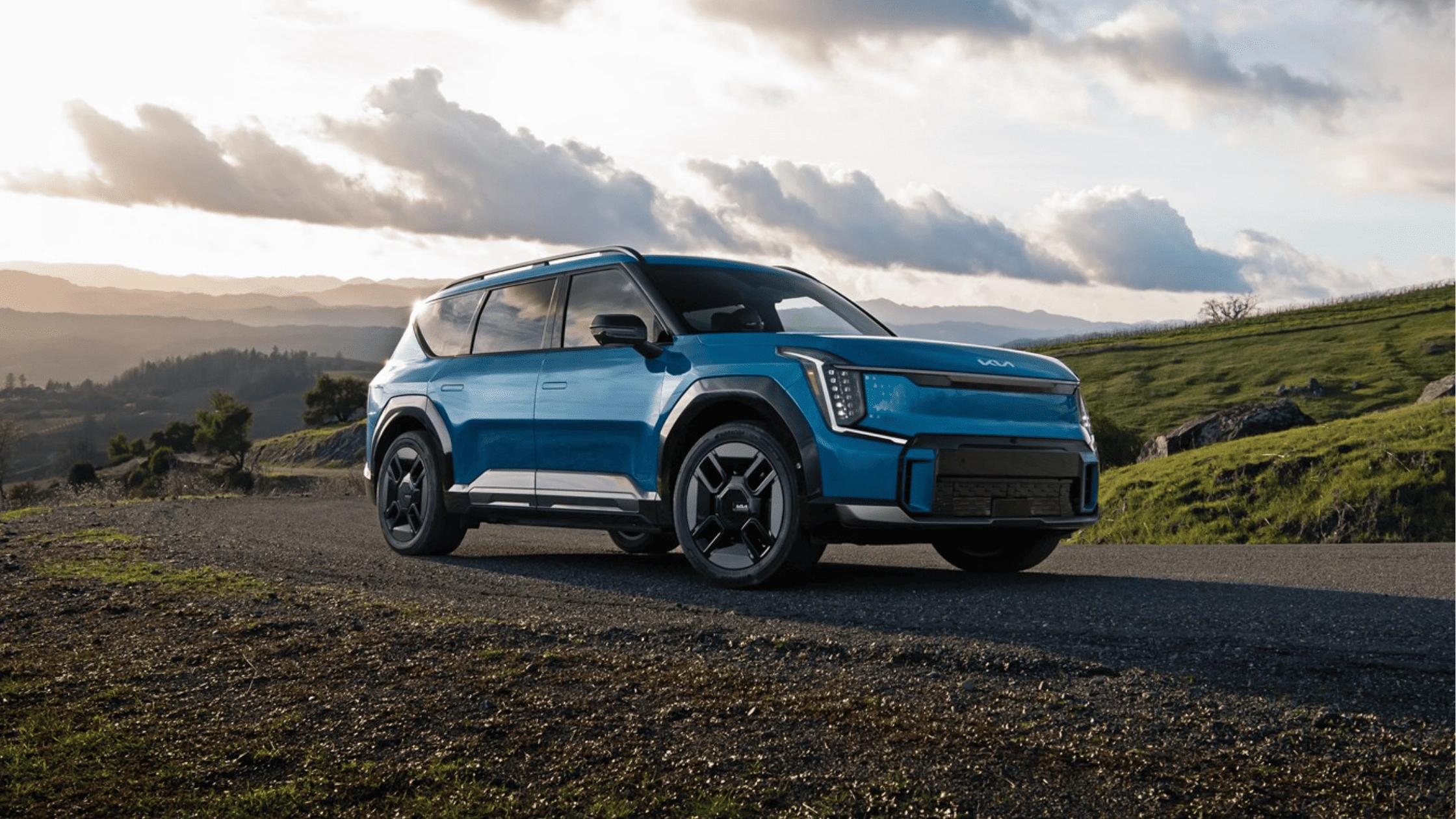 2025 Kia EV9 in Fort Myers, FL 2025 Kia EV9 electric SUV parked on a scenic mountain road near Fort Myers, FL