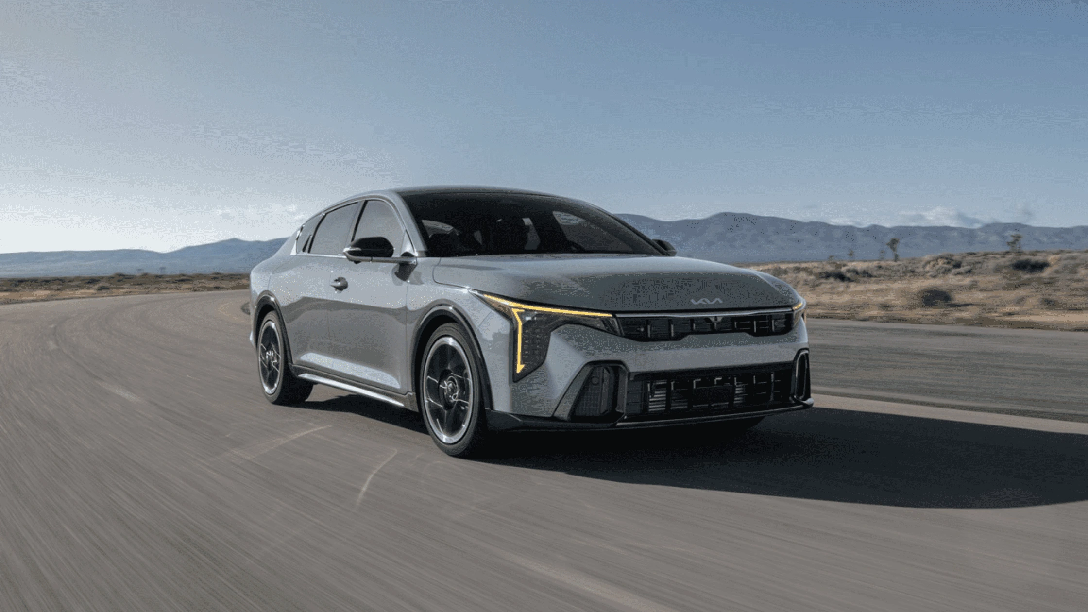 The 2025 Kia K4 in Fort Myers, FL The 2025 Kia K4 driving on an open road, displaying its sophisticated exterior design and LED headlights in Fort Myers, FL.