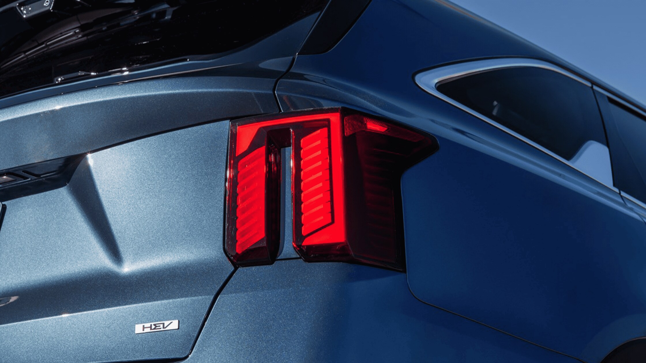 The 2024 Kia Sorento Hybrid near Port Charlotte, FL - Stylish and Modern Exterior Design Stylish rear taillight of the 2024 Kia Sorento Hybrid, highlighting its modern exterior design and hybrid technology near Port Charlotte, FL.