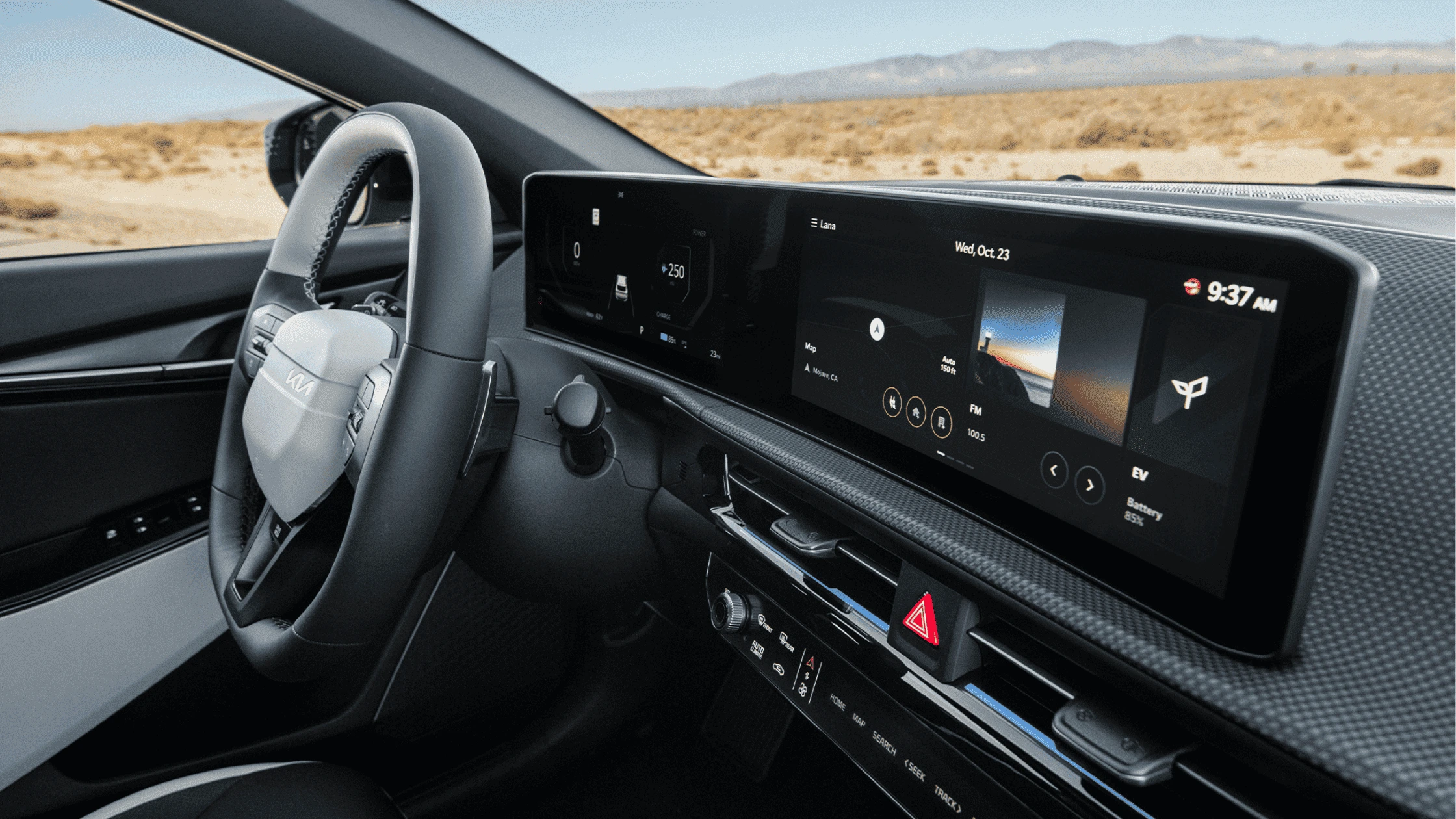 2025 Kia EV6 - Advanced Safety and Driver Assistance Features A close-up view of the 2025 Kia EV6 interior, highlighting its sleek digital dashboard with a wide touchscreen display, modern steering wheel design, and an expansive view of the desert landscape through the driver’s side window.