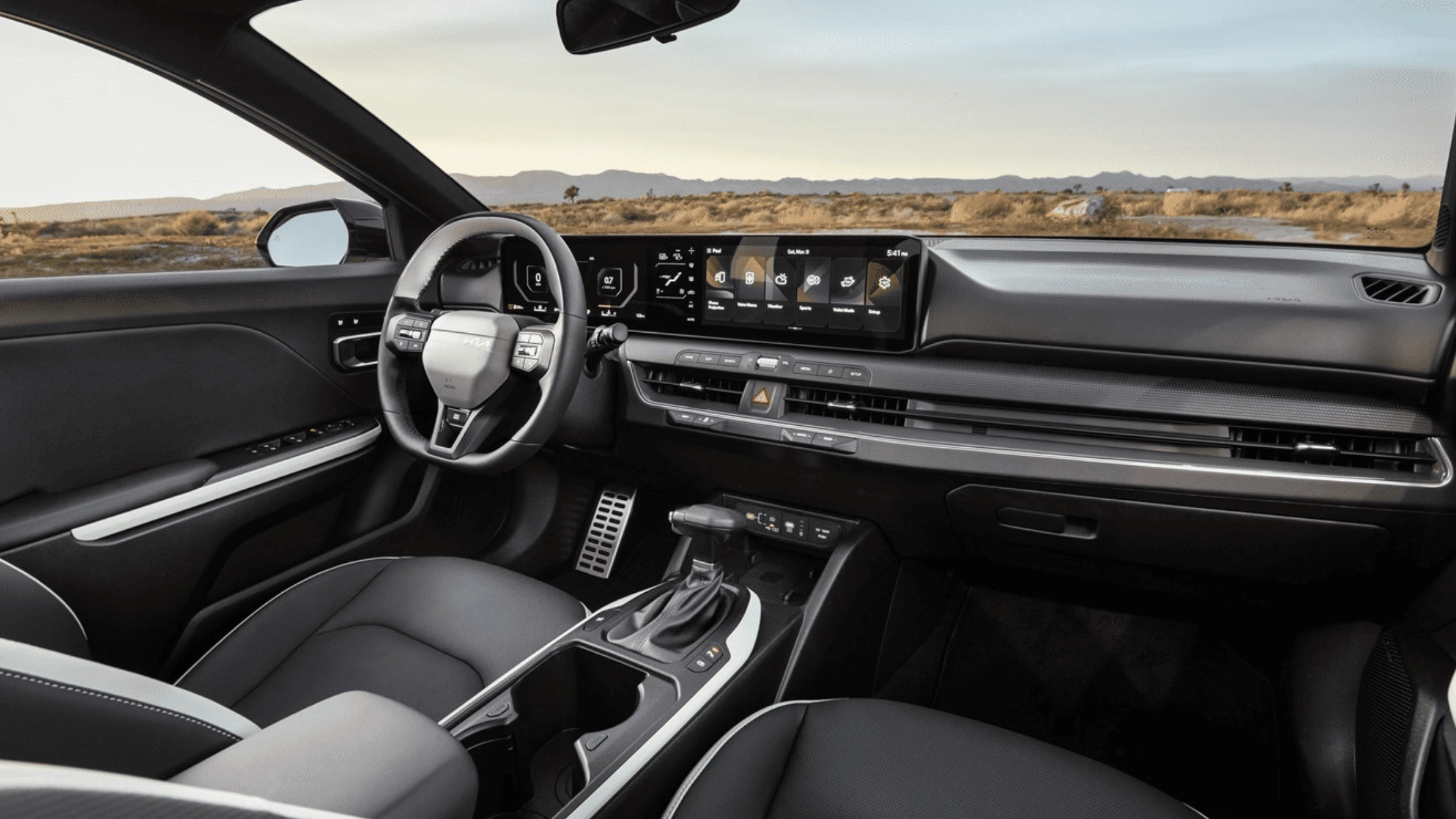 The 2025 Kia K4 - Sophisticated Design Inside and Out Interior of the 2025 Kia K4 showcasing a modern dashboard with a widescreen display and ergonomic design in Fort Myers, FL.