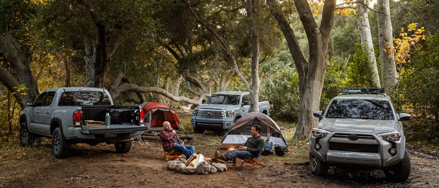 Grey Toyota Tacoma, Tundra, and 4Runner Parked in The Forest Camping