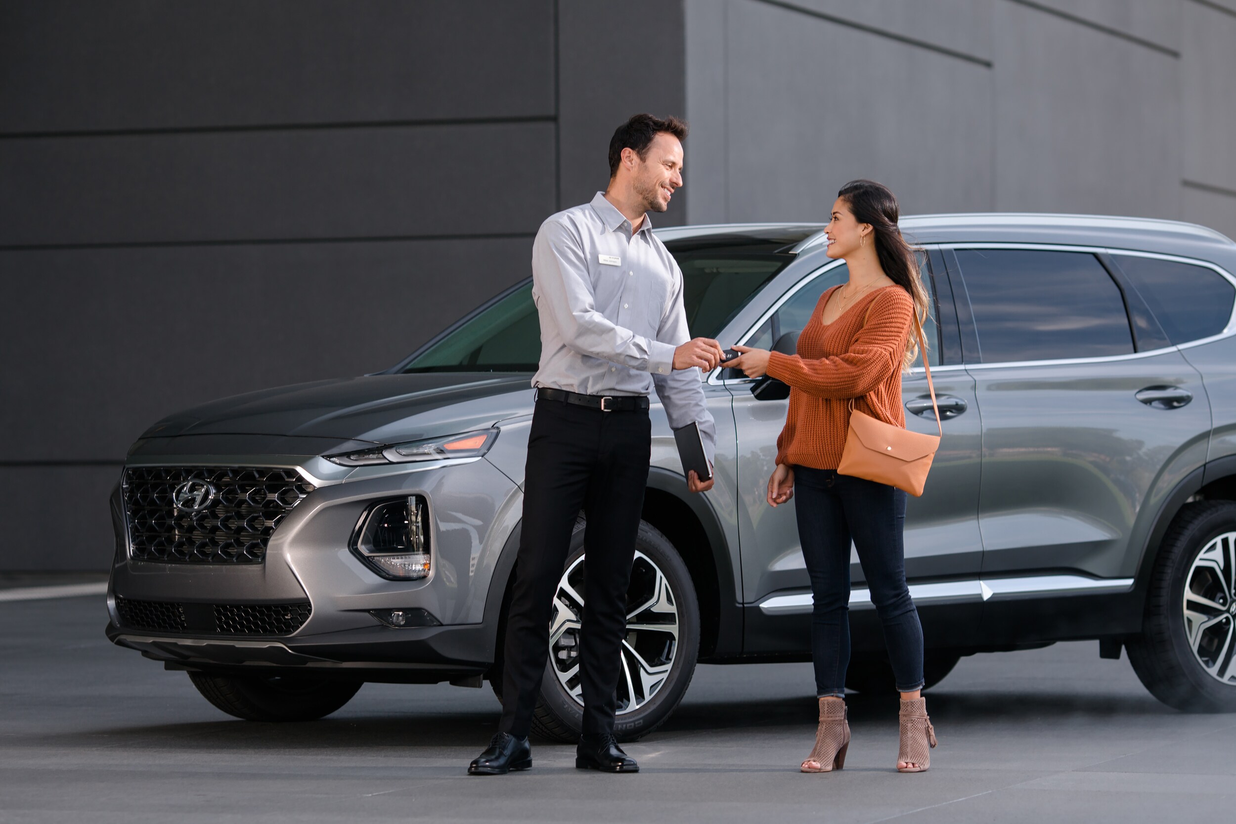 Hyundai rep giving keys to new car owner