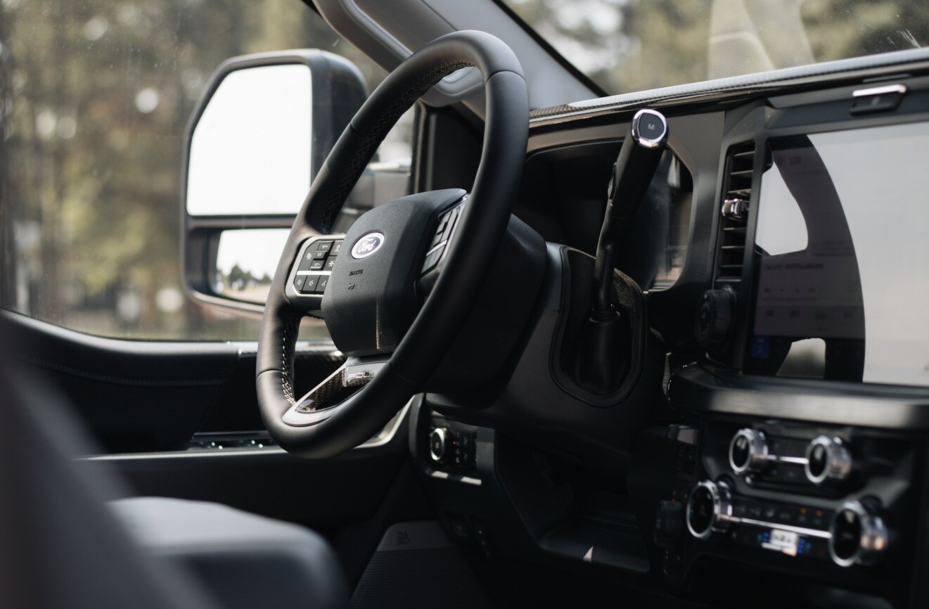 ROUSH Super Duty cabin with Ford steering wheel, column shifter, and center screen
