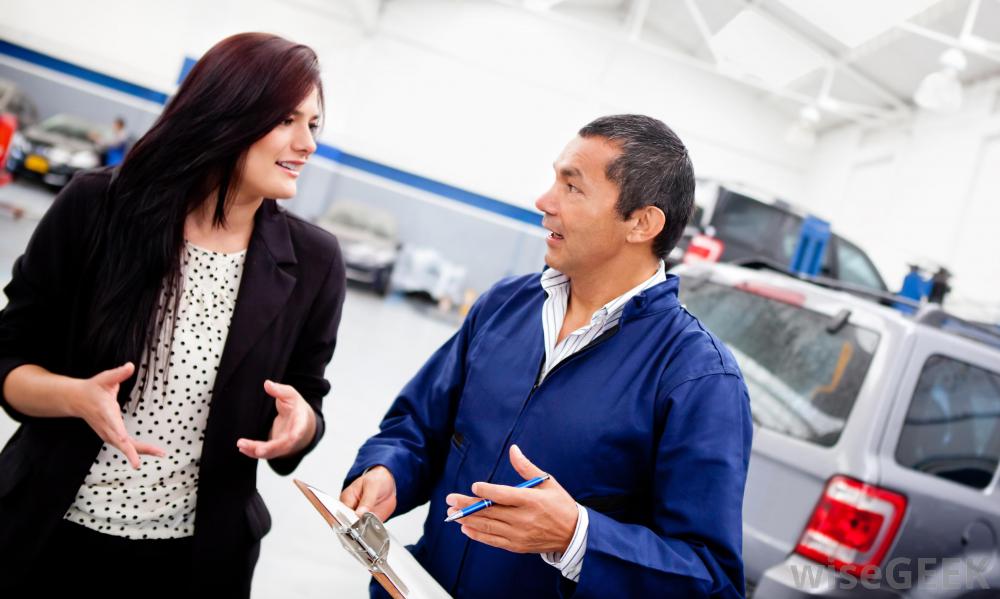 woman-speaking-to-mechanic-near-vehicle.jpg