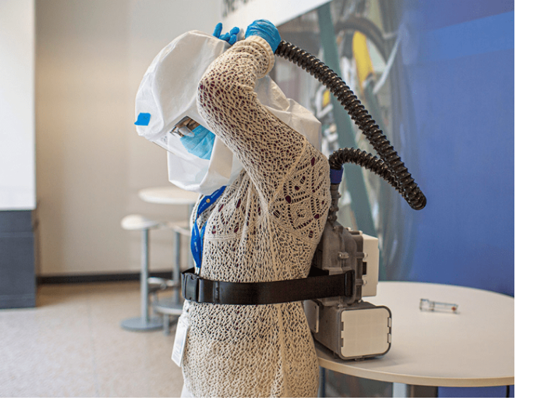 Employee Wears an Air-Purifying Respirator