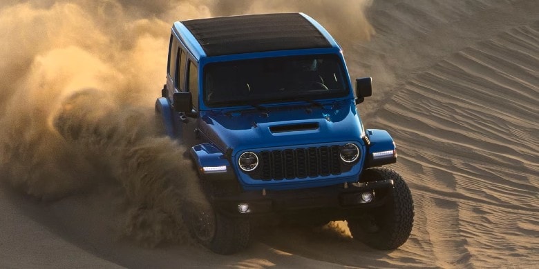 2024 Jeep Wrangler model driving through desert