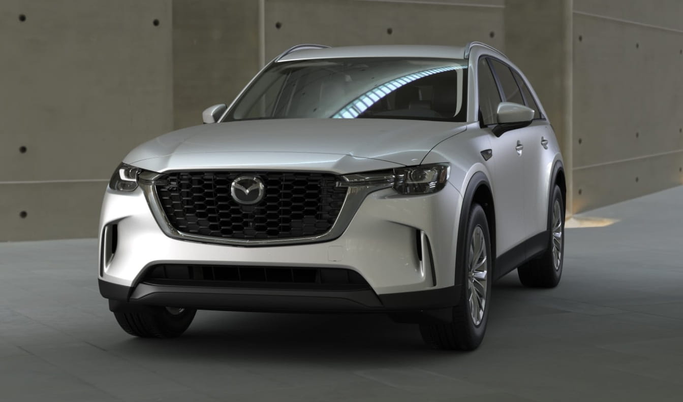 Front three-quarter view of the Mazda CX-90 SUV in white color.