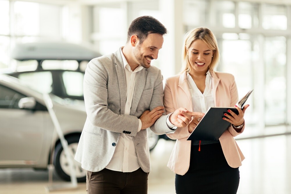 Customer talking with car dealer