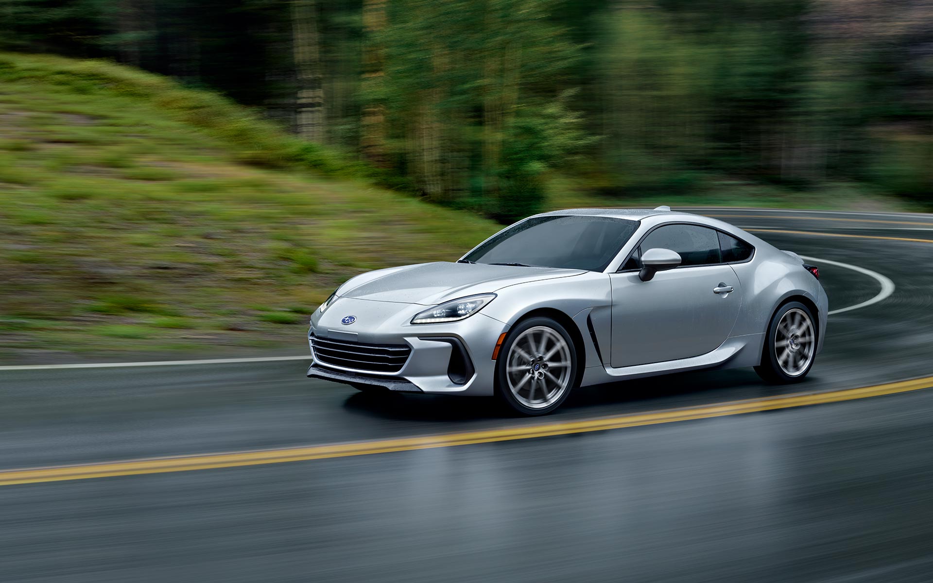 2023 Subaru BRZ driving on a wet road