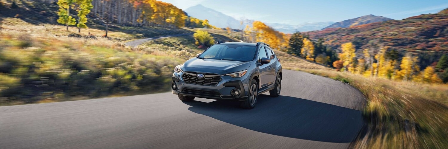 new Subaru Crosstrek SUV new Subaru SUV with driving on a rural road