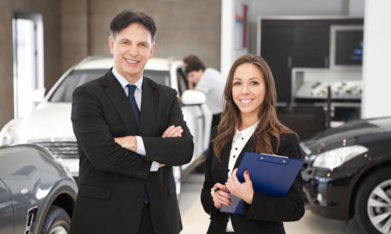 Car Sales People With Clipboard