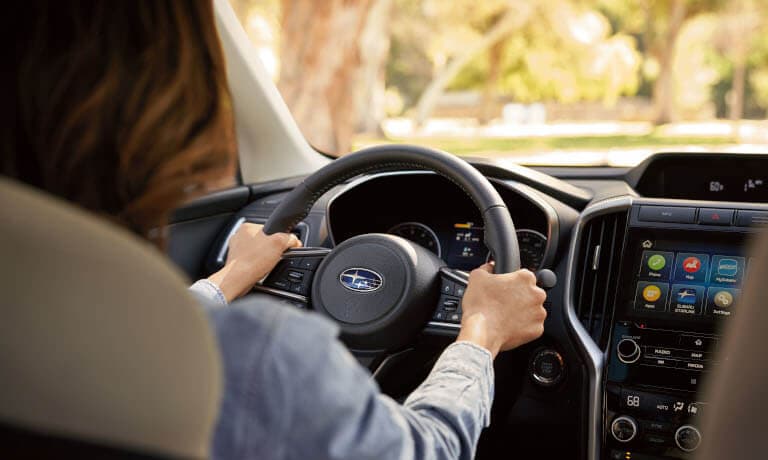 New 2022 Subaru Ascent with a women in the front seat