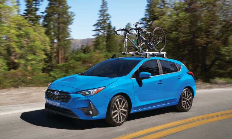 2025 Subaru Impreza Exterior On Turn With Bikes