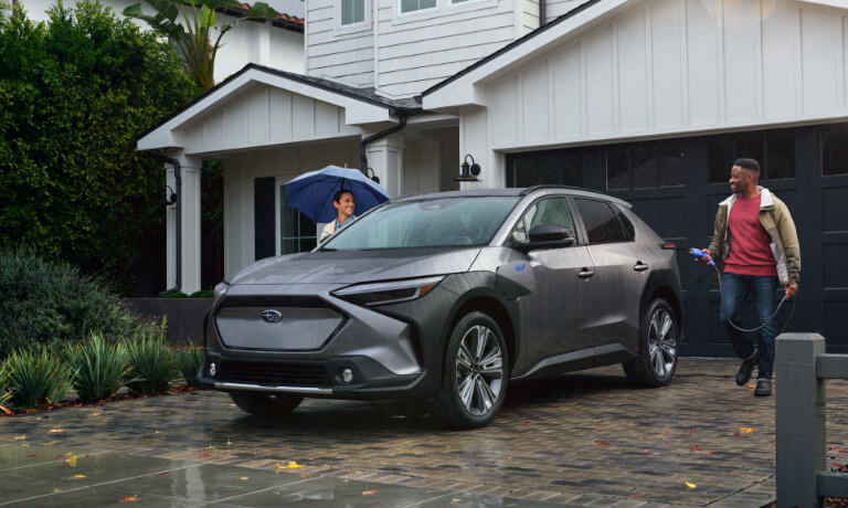 2024 Subaru Solterra Exterior Charging In Driveway